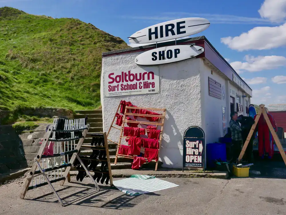 Saltline Surf Co. shop exterior on a sunny coastal day